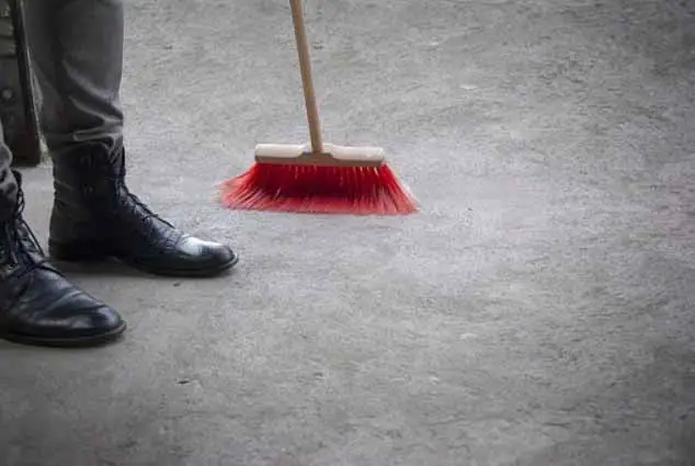 Sweeping Concrete Floor with Broom
